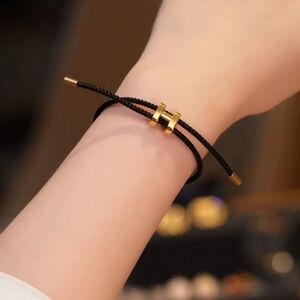 ✨ Black Braided Cable Bracelet with Gold-Tone Accents ✨